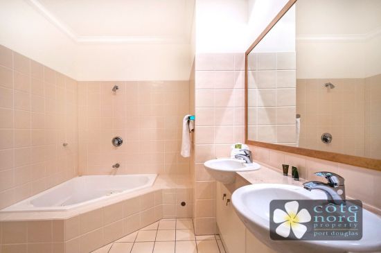 Ensuite with jacuzzi spa bath and twin handbasins