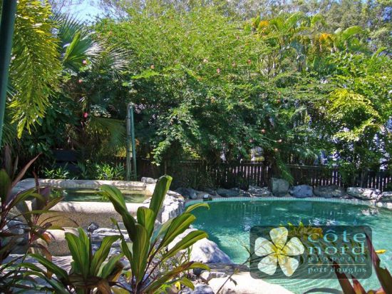 Jacuzzi by the resort swimming pool