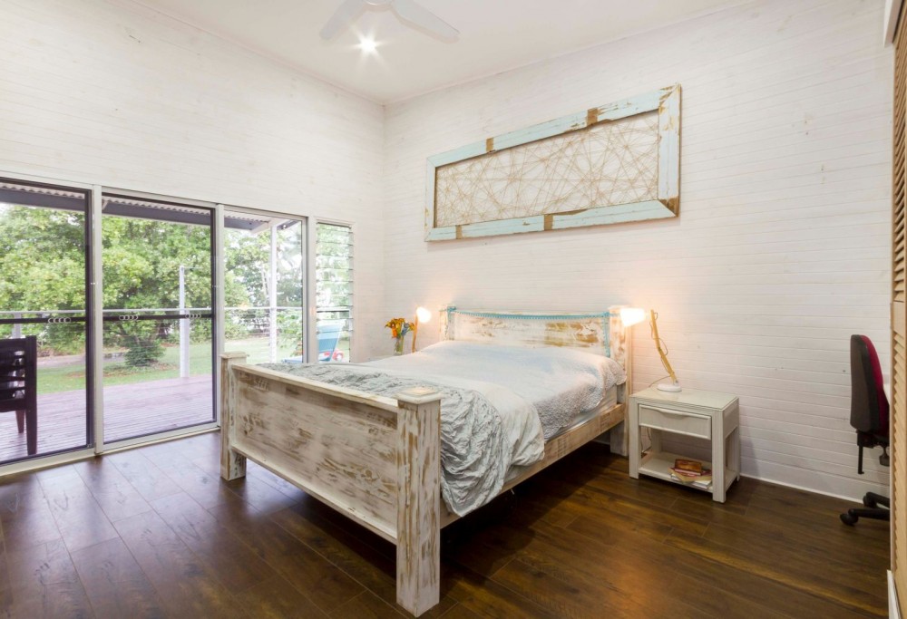 Main bedroom opening to the verandah and seabreeze