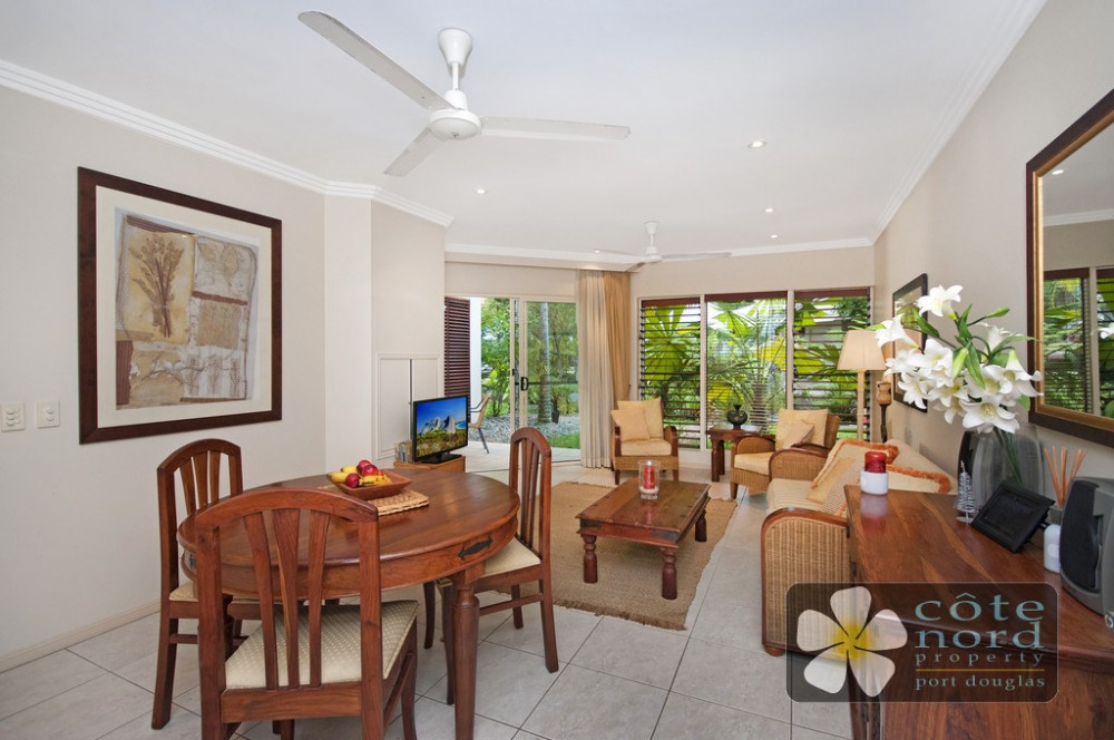 Dining and lounge area looking out on to tropical 
