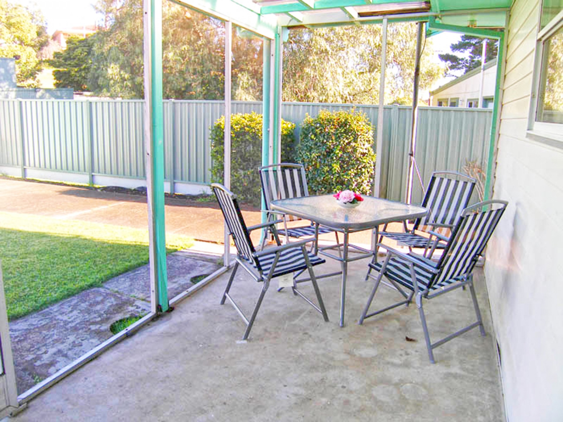 Outdoor entertaining area offers seating for 4
