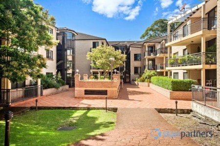 Well-presented ground-floor residence with 2 side-by-side secure car spaces