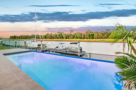 LUXURIOUS LOW SET HOME - Stunning Waterfront Living in Exclusive Calypso Bay