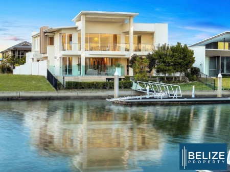 FLAWLESS EXECUTIVE WATERFRONT MASTERPIECE IN CALYPSO BAY WITH PRIVATE PONTOON