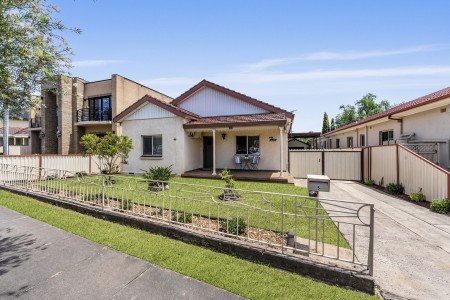 MANICURED BLOCK WITH 2 HOMES