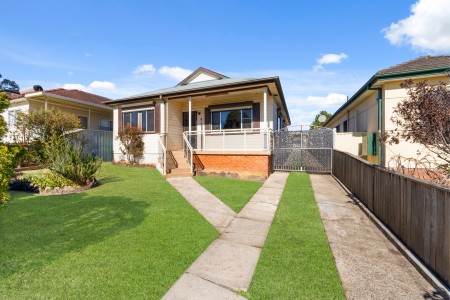 Air-Conditioned Three-Bedroom Home with Updated Kitchen and Tiled Living Areas!