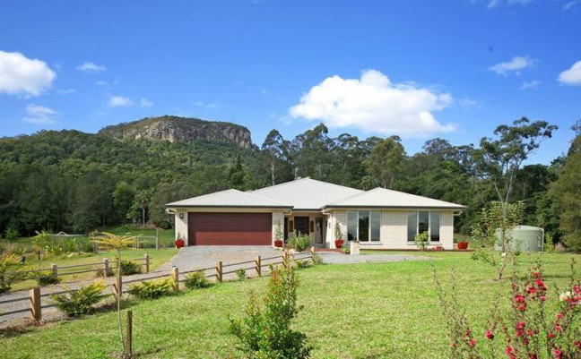 NEW PLANTATION STYLE HOME ON A LEVEL ACRE