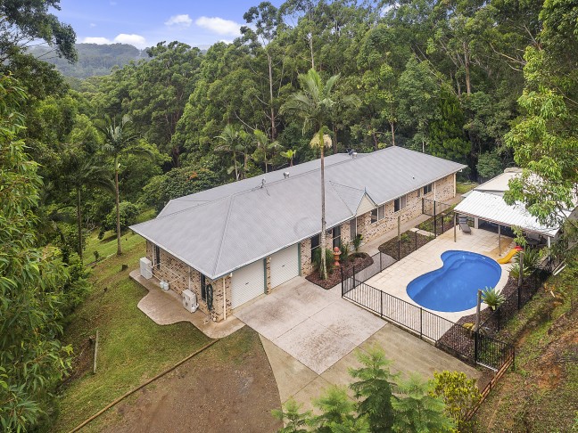 FAMILY HOME ON 1.5 PRIVATE ACRES WITH HEATED POOL