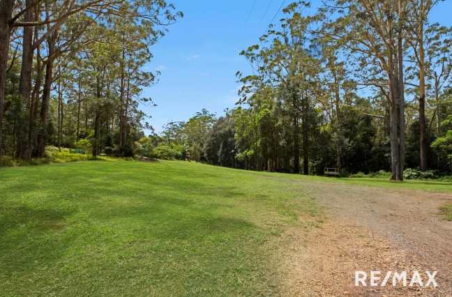 Serene Lifestyle Acreage Retreat with Dual Access and Rainforest Trails