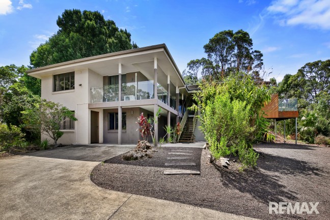 Two bedroom home on 1.5 acres plus 3 utility rooms bathroom & kitchenette downstairs.