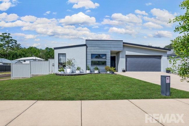 Welcome to 11 Creekline Place, Mooloolah Valley, where space, style, and serenity come together.