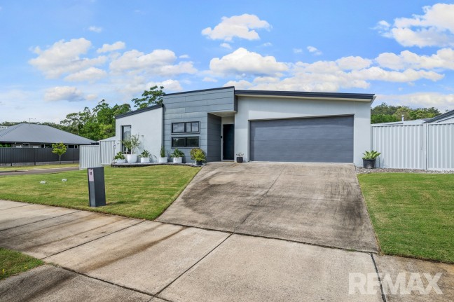 Welcome to 11 Creekline Place, Mooloolah Valley, where space, style, and serenity come together.