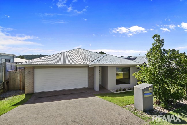 Modern five bedroom home or 4 bedroom plus two living areas with stunning views at back.