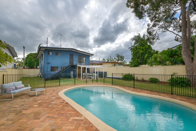 AFFORDABLE 2 LEVEL HOME/POOL - EXCELLENT LOCATION - ADDED POTENTIAL