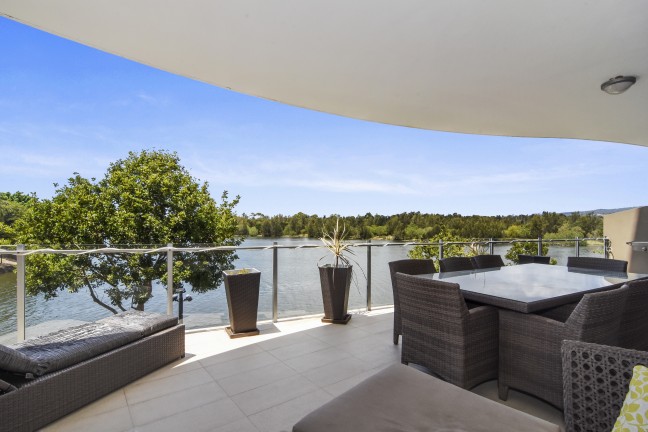 Waterfront, Emerald Lakes,  elevated ground floor apartment, two bedrooms plus a study nook